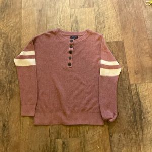 American Eagle pink sweater with white stripes on the sleeves